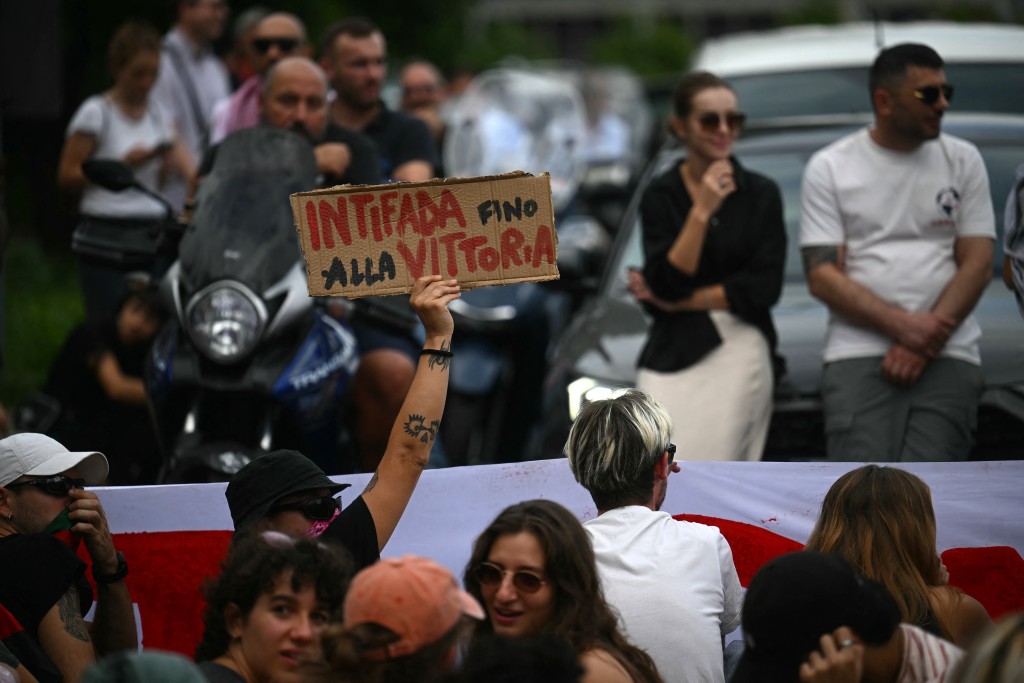 A protester hold a placard reading "Antifa till Victory" as they block the traffic during a protest part of the nationwide strike "Let's Block Everything" in solidarity with Palestinians in Gaza and calling for a halt to arms shipments to Israel, in Rome on September 22. (Photo by Filippo MONTEFORTE / AFP)