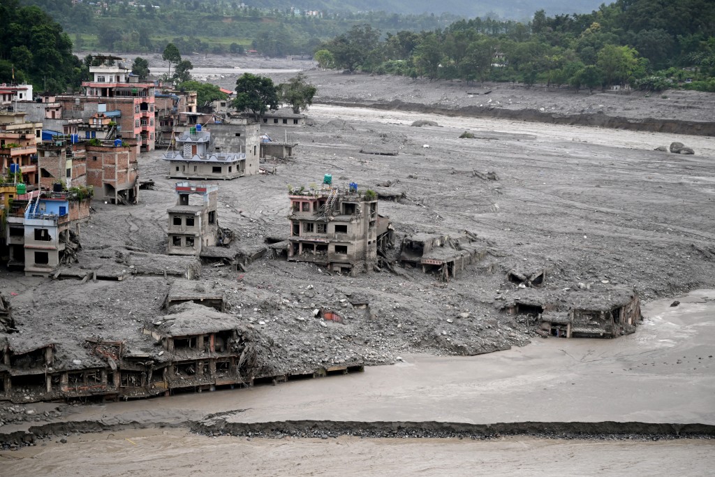 Damaged houses lie deluged in sludge after flash floods at Trishuli Center in Nepal's Nuwakot district on August 31, 2026. (AFP)