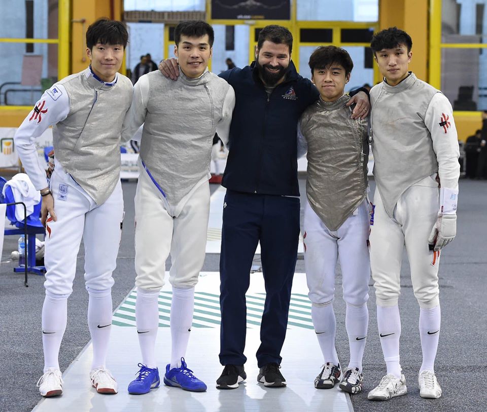 Hong Kong fencing coach Greg Koenig, center, is flanked by the men's foil team, from left, Cheung Ka-long, Cheung Siu-lun, Lawrence Ng, and Ryan Choi. Hong Kong fencing coach Greg Koenig, center, is flanked by the men's foil team, from left, Cheung Ka-long, Cheung Siu-lun, Lawrence Ng, and Ryan Choi.
