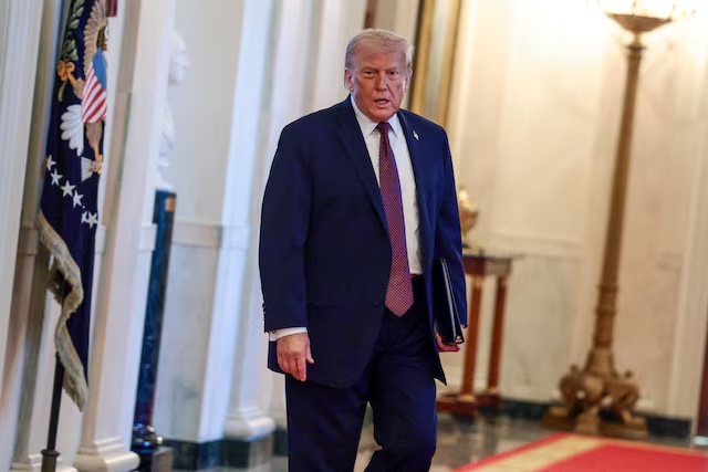 U.S. President Donald Trump arrives to honor the NHL Stanley Cup champions Florida Panthers at the White House in Washington, D.C., U.S., January 15, 2026. REUTERS/Evelyn Hockstein