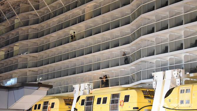 Passengers on the Royal Caribbean's Quantum of the Sea on December 9, 2020 at Marina Bay Cruise Centre Singapore. Passengers on the Royal Caribbean's Quantum of the Sea on December 9, 2020 at Marina Bay Cruise Centre Singapore.