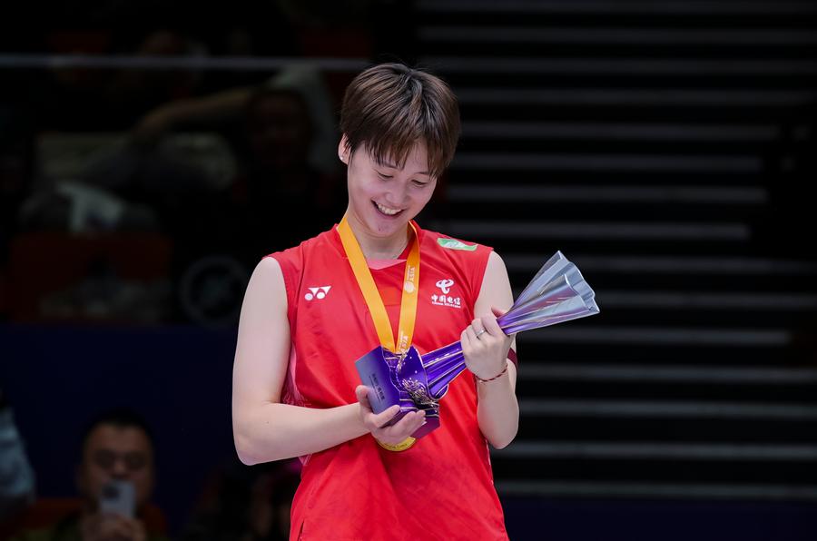 Gold medalist Chen Yufei of China looks at the troghy during the awarding ceremony for the women's singles event at Badminton Asia Championships 2025 in Ningbo, east China's Zhejiang Province, April 13, 2025. (Xinhua)