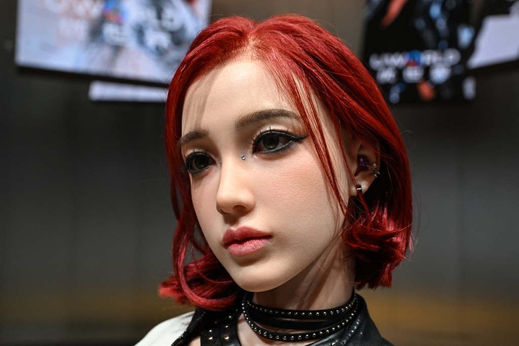 Photo by ADEK BERRY / AFP  A humanoid robot is displayed during the launch of the U1 humanoid robot produced by UWORLD, a brand under UBTECH Robotics, in Shenzhen, China's Guangdong province on June 30, 2026.