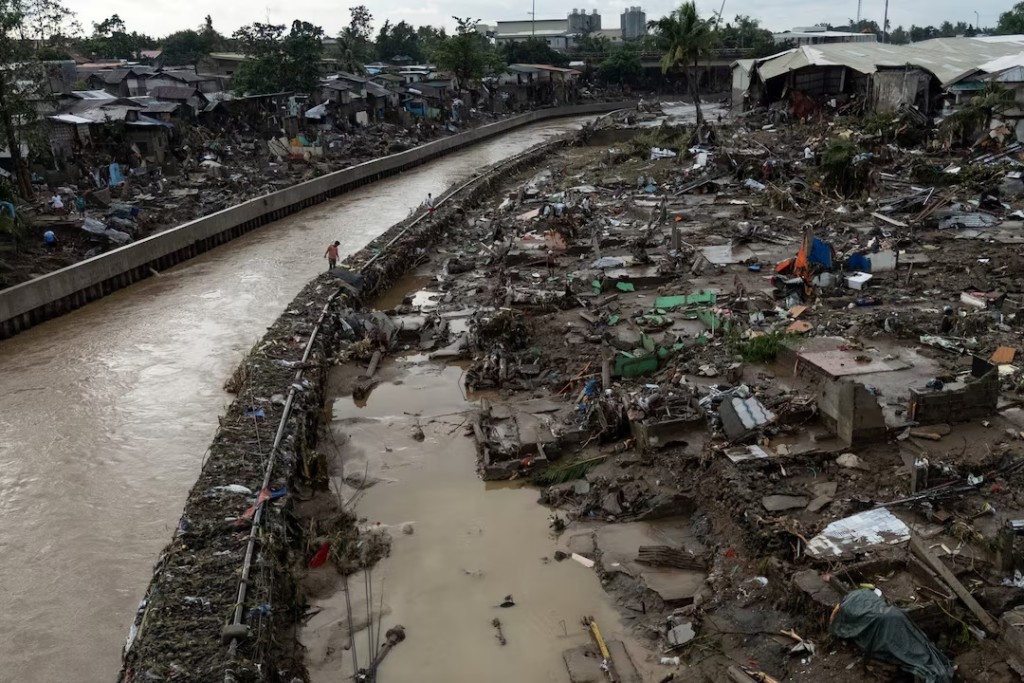 A drone view shows a man walking amid the damage caused by Typhoon Kalmaegi in Talisay, Cebu, Philippines, November 5, 2025. REUTERS/Eloisa Lopez