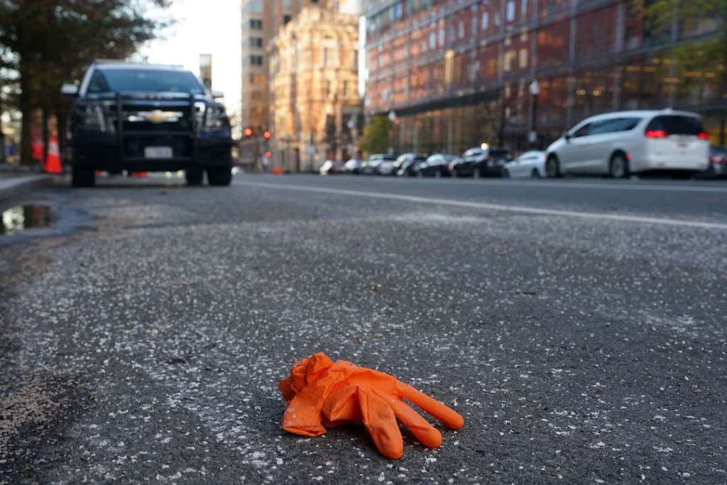 A discarded rubber glove lies at the scene, a day after two National Guard members were shot in Washington, D.C., U.S., November 27, 2025. REUTERS/Nathan Howard 