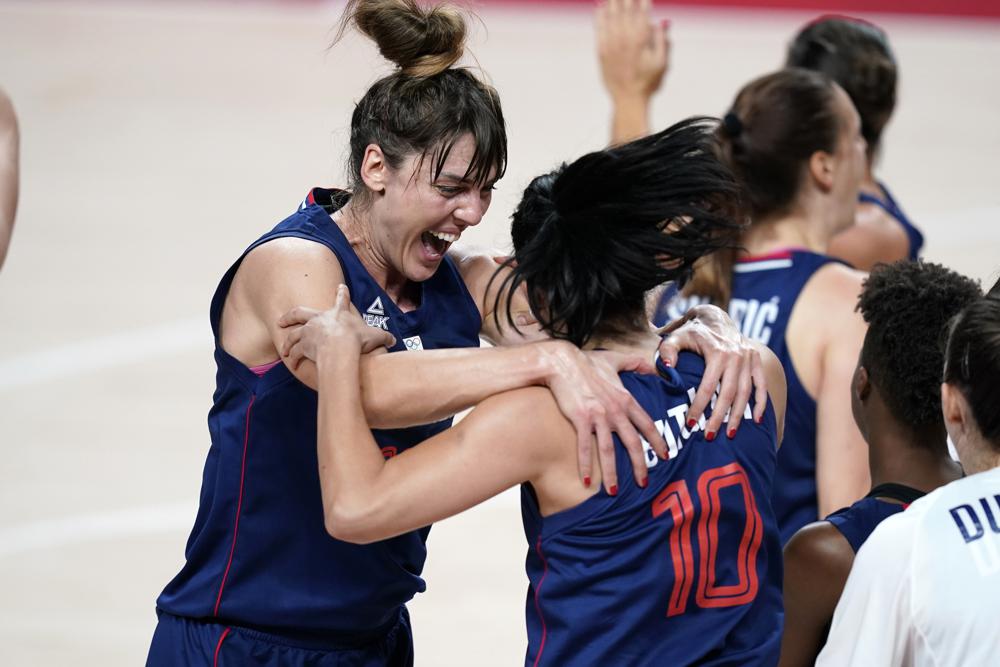 Serbia's Tina Krajisnik celebrates with teammate Dajana Butulija (10) at the end of a women's basketball quarterfinal round game against China at the 2020 Summer Olympics, Wednesday Serbia's Tina Krajisnik celebrates with teammate Dajana Butulija (10) at the end of a women's basketball quarterfinal round game against China at the 2020 Summer Olympics, Wednesday