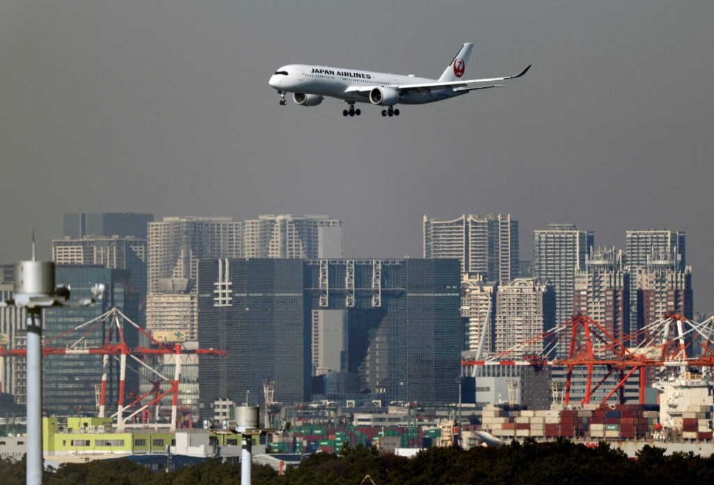 An airplane of Japan Airlines (JAL) approaches to land at Haneda International Airport in Tokyo, Japan January 5, 2024. REUTERS