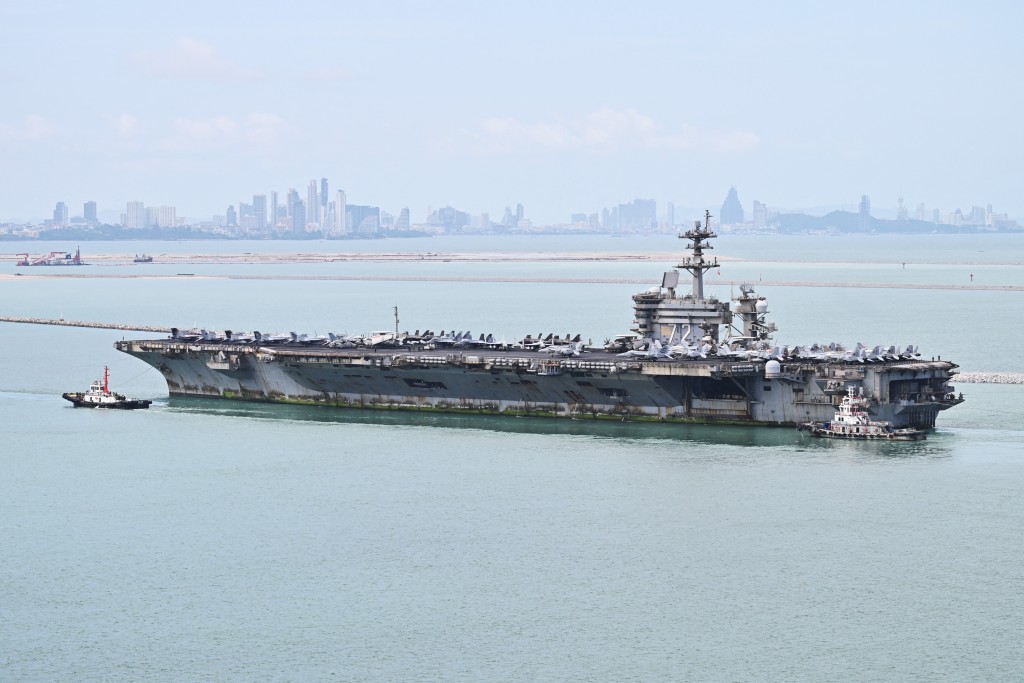 US nuclear-powered aircraft carrier USS Abraham Lincoln (CVN-72) is seen near Laem Chabang Port, in the Gulf of Thailand on September 2, 2026, near the city of Pattaya (back). (Photo by ANTHONY WALLACE / AFP)