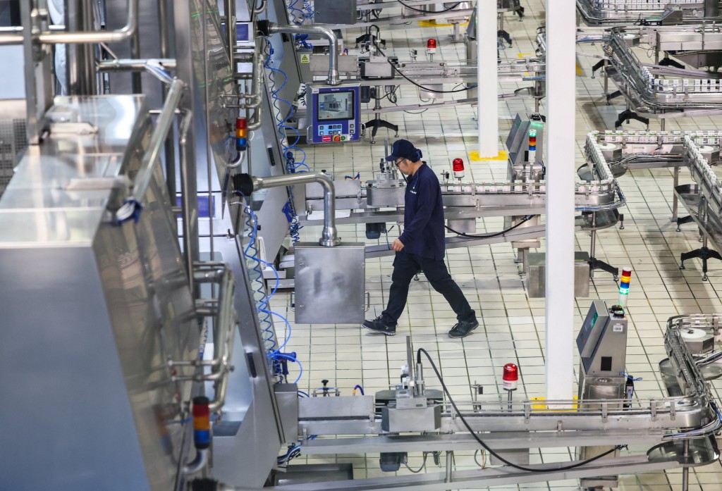 An employee walks at Mengniu milk processing factory during organized media tour in Hohhot, Inner Mongolia Autonomous Region, China, June 11, 2026. REUTERS/Maxim Shemetov