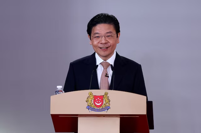 Singapore's Prime Minister Lawrence Wong speaks during a swearing-in ceremony of Singapore's new Cabinet ministers at the Istana, in Singapore, May 23, 2025. REUTERS/Edgar Su/Pool 