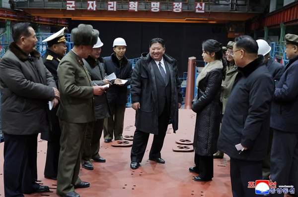 North Korean leader Kim Jong Un visits the construction site of an 8,700-ton nuclear-powered submarine capable of launching surface-to-air missiles in this picture released by North Korea's official Korean Central News Agency on December 25, 2025. KCNA via REUTERS
