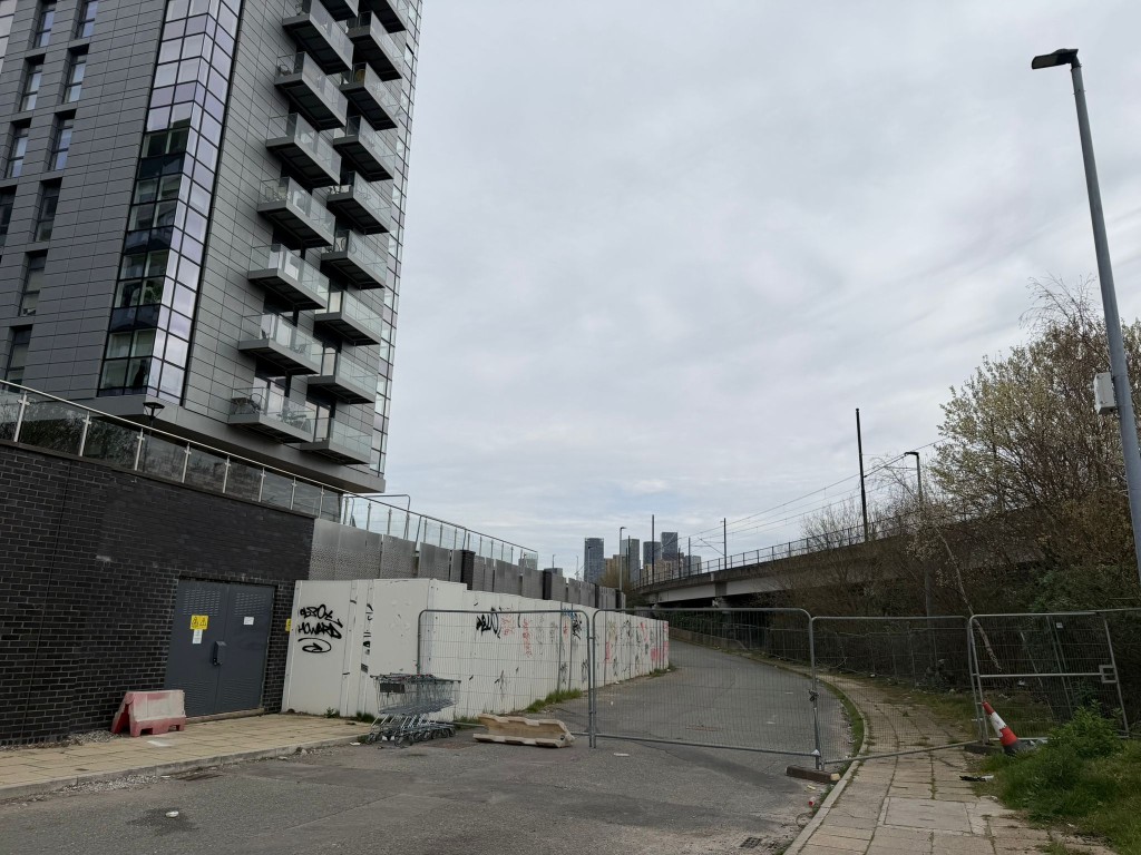 Blocks D and E of X1 Manchester Water, which have not had their foundations laid—have been enclosed by iron railings.