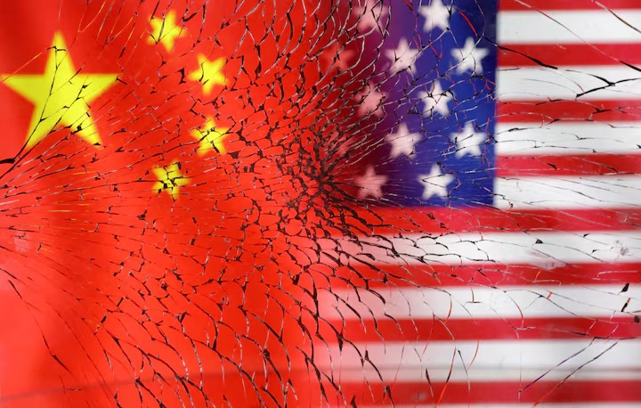 U.S. and Chinese flags are seen through broken glass in this illustration taken, January 30, 2023. (Reuters) U.S. and Chinese flags are seen through broken glass in this illustration taken, January 30, 2023. (Reuters)