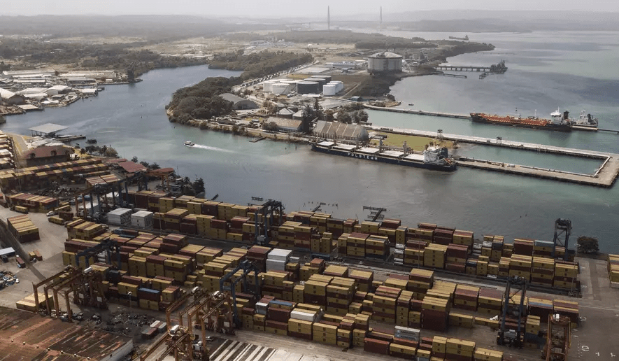 Cargo containers sit stacked as cranes load and unload containers from cargo ships at the Cristobal port, operated by the Panama Ports Company, in Colon, Tuesday, Panama, Feb. 4, 2025. (AP Photo/Matias Delacroix) Cargo containers sit stacked as cranes load and unload containers from cargo ships at the Cristobal port, operated by the Panama Ports Company, in Colon, Tuesday, Panama, Feb. 4, 2025. (AP Photo/Matias Delacroix)