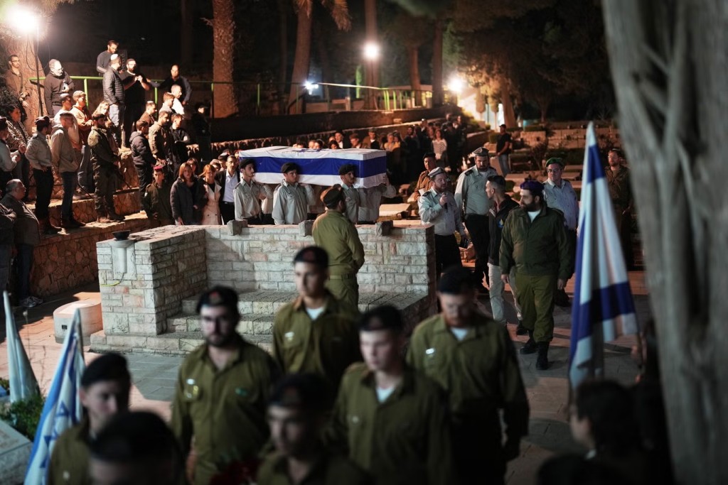 Released hostage attends funeral of soldier as body returned from Gaza - AP