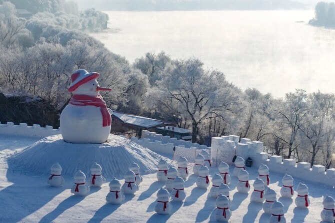 This photo taken on January 12, 2025 shows snowman installations beside frost-covered trees on the banks of Songhua River in Jilin, northeast China's Jilin province. (AFP) This photo taken on January 12, 2025 shows snowman installations beside frost-covered trees on the banks of Songhua River in Jilin, northeast China's Jilin province. (AFP)