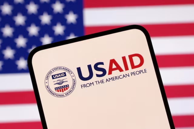 USAID logo and U.S. flag are seen in this illustration taken April 23, 2025. REUTERS/Dado Ruvic/Illustration 