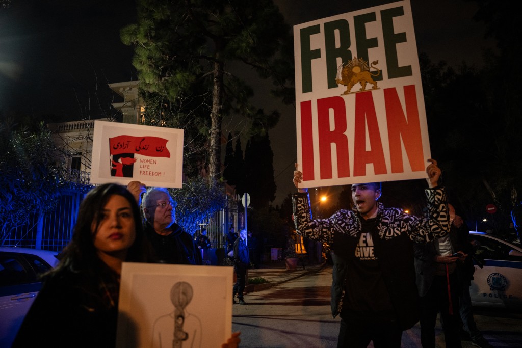 Iranian nationals living in Greece take part in a rally in support of the Iranian people in front of the Iranian Embassy in Athens on January 16, 2026. (Photo by Angelos TZORTZINIS / AFP)