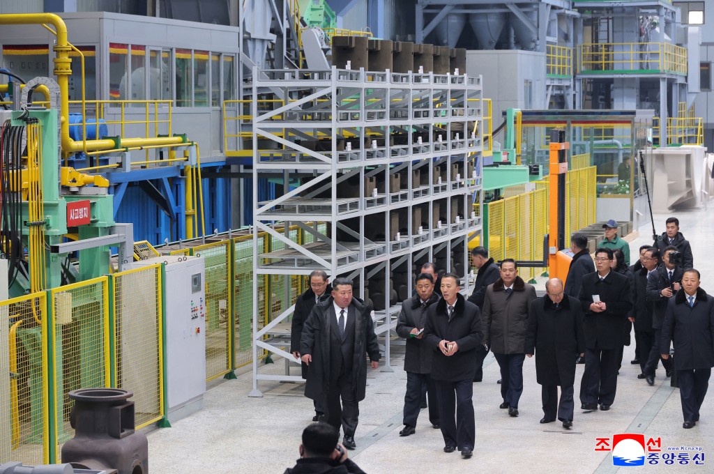 This picture taken on January 19, 2026 and released by North Korea's official Korean Central News Agency (KCNA) on January 20, 2026 shows North Korean leader Kim Jong Un (L) inspecting the Ryongsong Machine Complex in South Hamgyong Province, which has completed the first phase of its renovation and modernisation project. (Photo by KCNA VIA KNS / AFP)