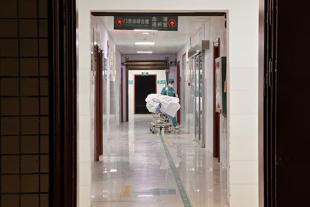 File Photo: A nurse moves a bed through a corridor at a hospital in Duan Yao autonomous county in Guangxi region, China January 9, 2025. REUTERS/David Kirton/File Photo