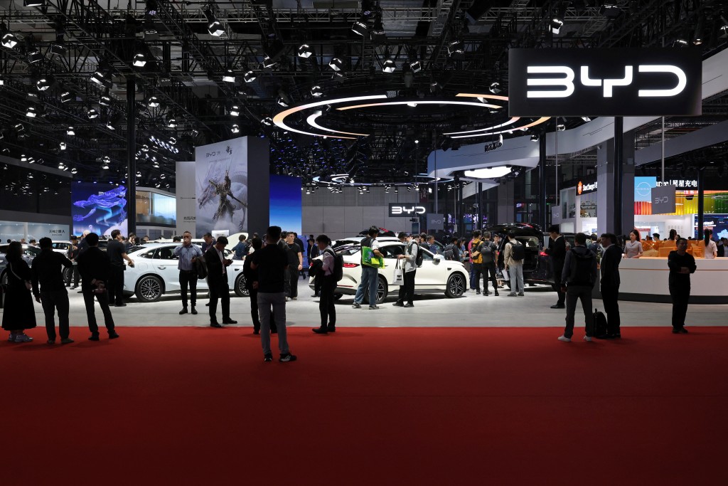 People visit the BYD booth during a media day for the Auto Shanghai show in Shanghai, China April 23, 2025. REUTERS/Go Nakamura