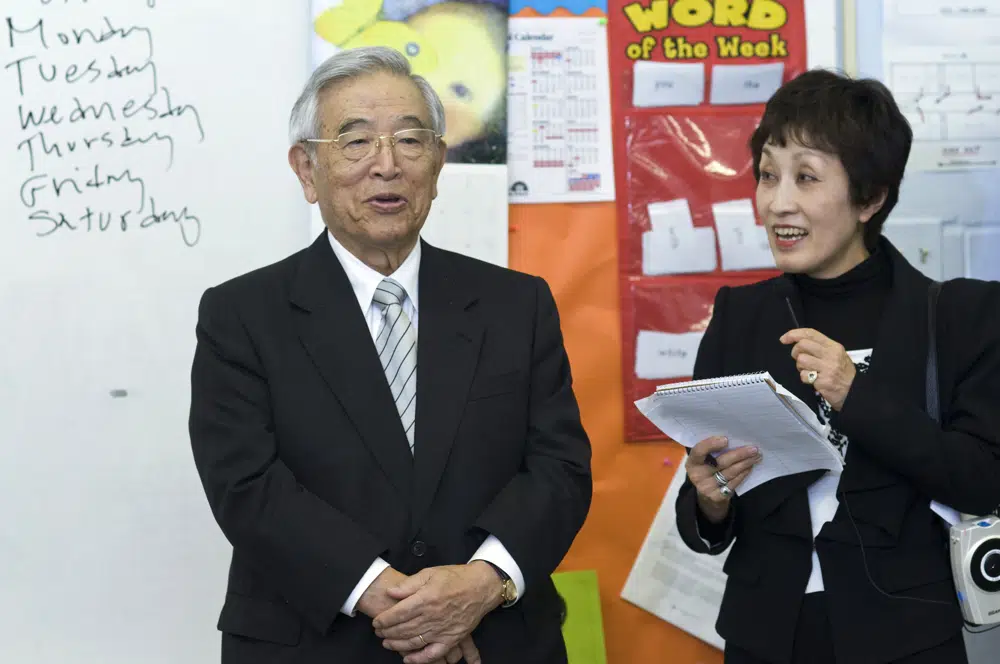 Dr. Shoichiro Toyoda, center, then honorary chairperson of Toyota with his translator Ms. Morita, left, speaks to a classroom at St. Bartholomew School Monday, April 4, 2011, in Louisville, Ky. (AP) Dr. Shoichiro Toyoda, center, then honorary chairperson of Toyota with his translator Ms. Morita, left, speaks to a classroom at St. Bartholomew School Monday, April 4, 2011, in Louisville, Ky. (AP)