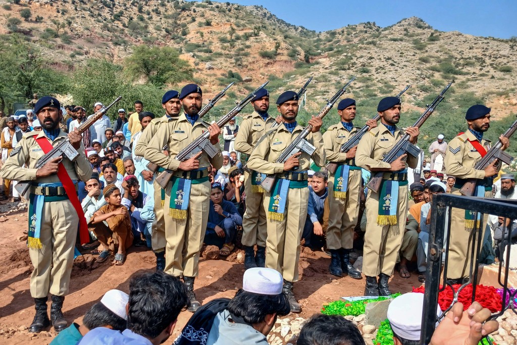 Photo by SYED BASIT / AFP. Pakistan Army's ceremonial guards perform during the funeral ceremony of a paramilitary personnel of the Frontier Corps (FC) who was killed during the Afghanistan-Pakistan border clashes, in Kohat on October 17, 2025.
