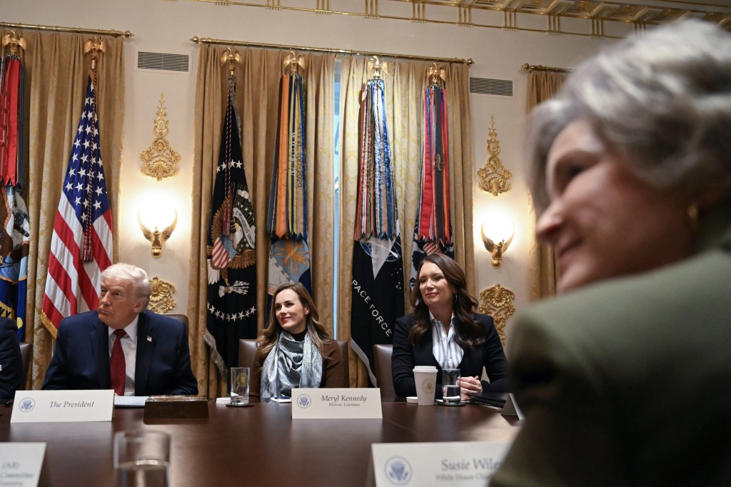 Photo by ANDREW CABALLERO-REYNOLDS / AFP  US President Donald Trump, Meryl Kennedy, CEO of 4Sisters Rice, US Secretary of Agriculture Brooke Rollins and White House Chief of Staff Susie Wiles look on during a roundtable event to discuss aid for farmers, in the Cabinet Room of the White House in Washington, DC, on December 8, 2025.
