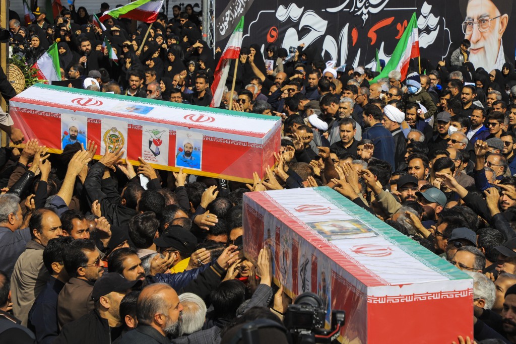 Photo by SARE TAJALI / ISNA / AFP  In this picture obtained from Iran's ISNA news agency on March 5, 2026, mourners in the city of Kerman attend the funeral of those killed in the US-Israeli war with Iran.
