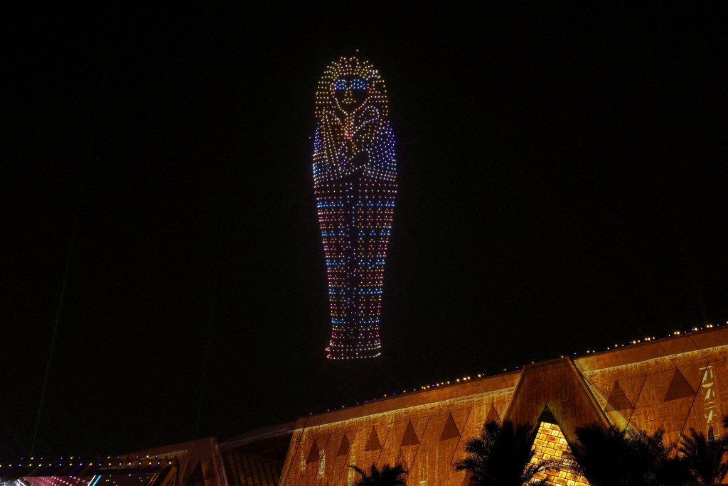 A drone light show depicts ancient pharaoh king Tutankhamen's sarcophagus during the opening ceremony of the Grand Egyptian Museum (GEM), near the Giza pyramid complex, in Giza, Egypt, November 1, 2025. (Reuters)