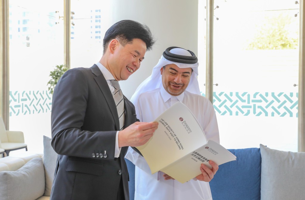 Roden Tong with Qatar Investment and Trade Court president Judge Khalid bin Ali Al Obaidli. 