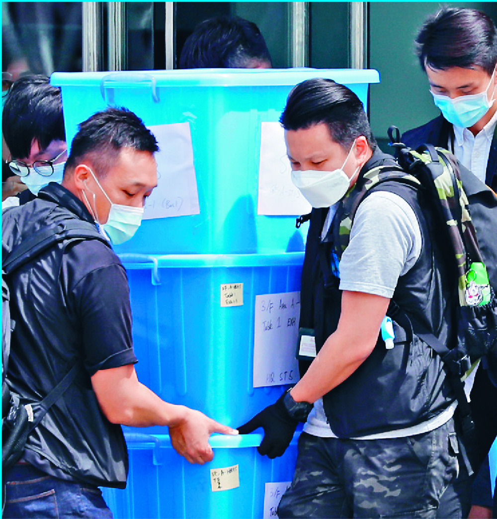 Police remove crates of evidence. Reuters