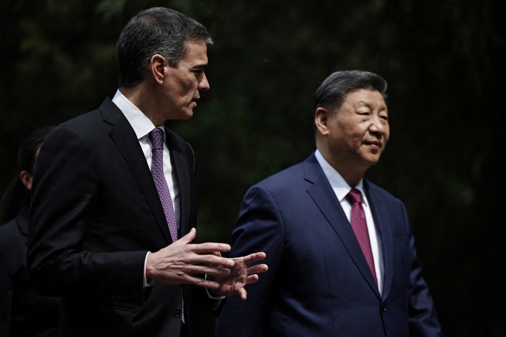 Spanish Prime Minister Pedro Sanchez and Chinese President Xi Jinping speak as they walk along the gardens of Diaoyutai Guest House after a meeting in Beijing, China, 11 April 2025. REUTERS