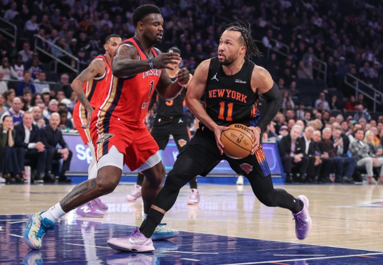 Jalen Brunson looks to drive past Pelicans forward Zion Williamson. REUTERS