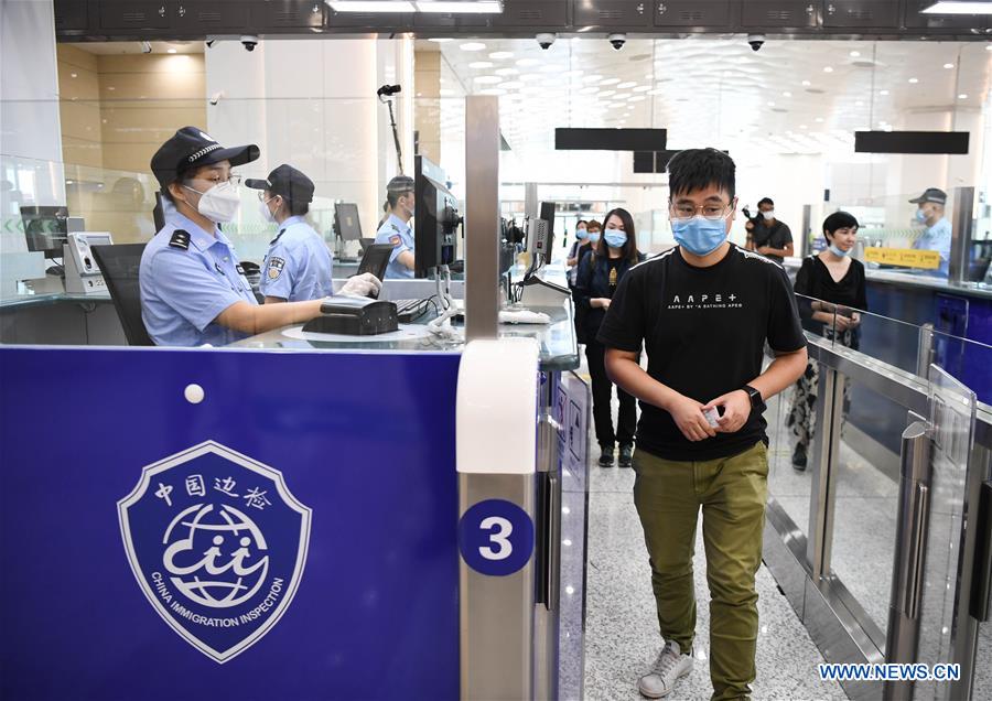 In a pre-opening trial, passenger clearance at new Hengqin port in Zhuhai, is put to the test.