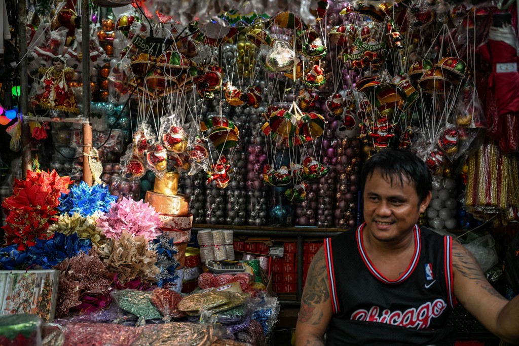 Photo by JAM STA ROSA / AFP  This photo taken on September 1, 2026 shows a vendor selling Christmas decorations at Divisoria market in Manila.