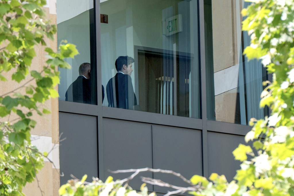 Photo by KARL MONDON / AFP  OpenAI CEO Sam Altman walks past the fourth floor window at the Ronald V. Dellums US Courthouse in Oakland, California on April 28, 2026.