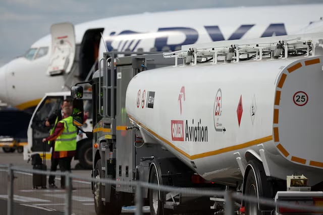 A fuel tanker truck operated by Orlen Aviation drives past Ryanair aircraft on the apron at Warsaw Modlin Airport in Nowy Dwor Mazowiecki, Poland, April 28, 2026. REUTERS/Kacper Pempel 