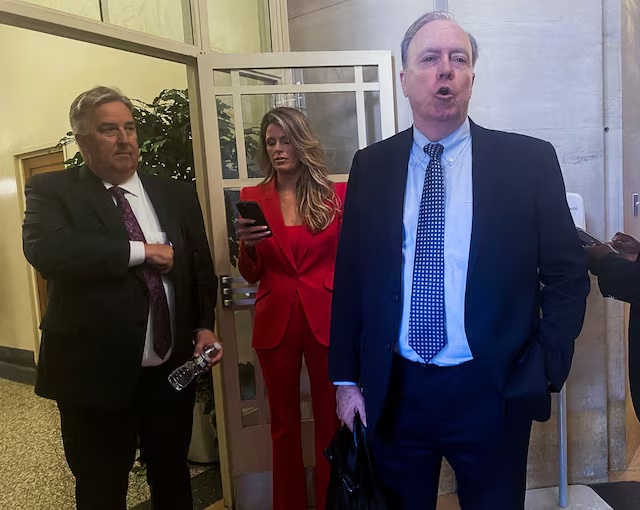 Attorneys for former U.S. President Donald Trump; James Trusty, Lindsey Halligan and John Rowley, depart the U.S. Justice Department after meeting with Justice Department officials over the Trump Mar-a-Lago classified documents case, after Trump's lawyers last month sent the department a letter asking for a meeting with U.S. Attorney General Merrick Garland, in Washington, U.S. June 5, 2023. REUTERS/Sarah Lynch/File Photo