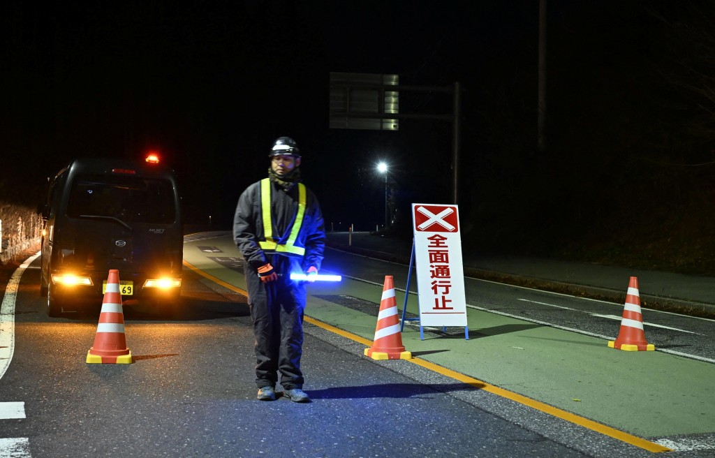 Traffic is restricted on a road following the issuance of a tsunami warning in Rikuzentakata, Iwate Prefecture, Japan, December 9, 2025, in this photo taken by Kyodo. Mandatory credit Kyodo/via REUTERS 