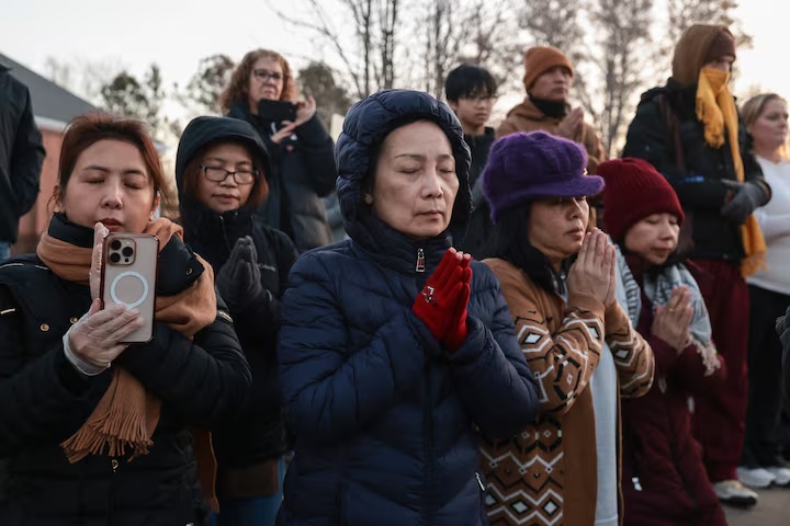 People participate in a morning meditation with monks during the "Walk for Peace" in Ruther Glen, Virginia, February 5, 2026. REUTERS/Evelyn Hockstein