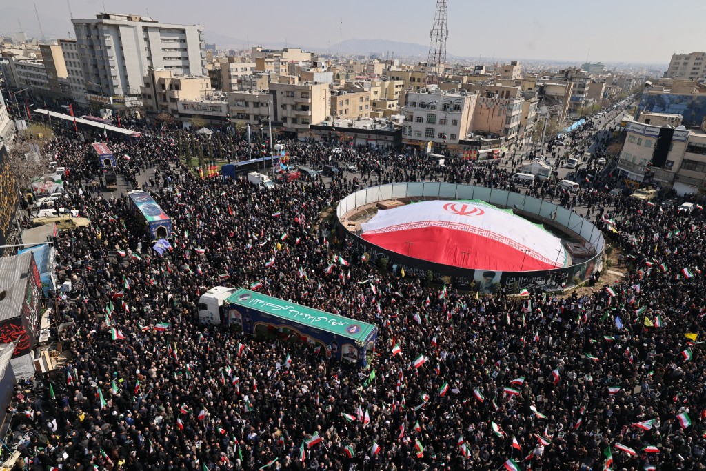 Photo by ATTA KENARE / AFP  Iranian mourners gather during the funeral of Iran's security chief Ali Larijani and Gholamreza Soleimani, a senior officer in the Islamic Revolutionary Guard Corps who commands Basij forces, in Tehran on March 18, 2026.