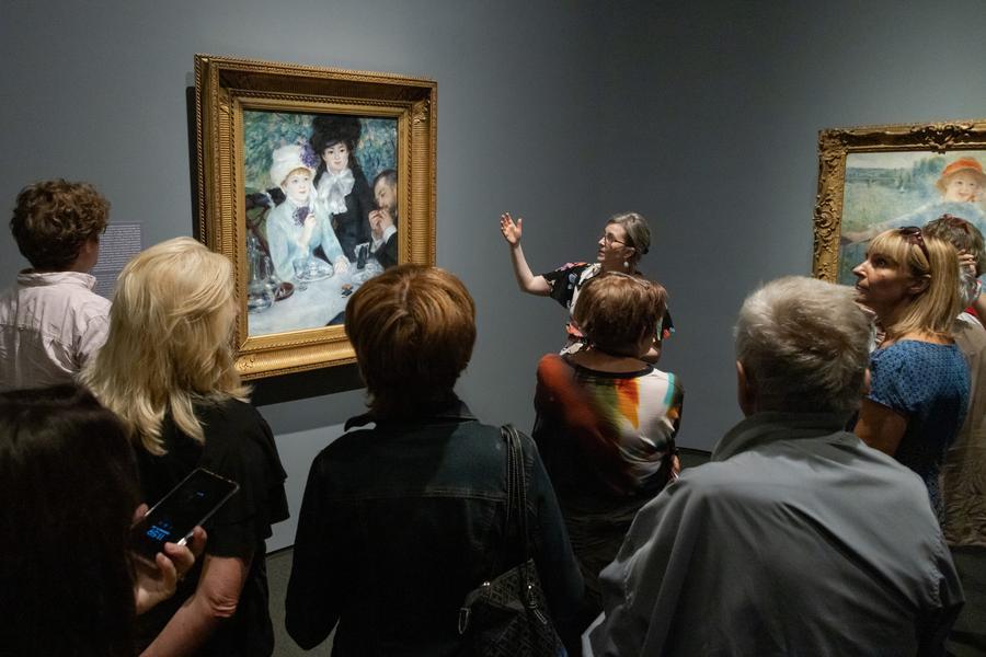 Visitors watch an artwork on display by Pierre-Auguste Renoir in the Museum of Fine Arts in Budapest, Hungary. (Xinhua/File)