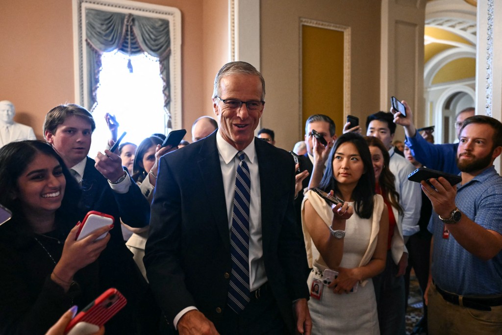 Photo by KENT NISHIMURA / AFP  US Senate Majority Leader John Thune, Republican from South Dakota, is surrounded by reporters as he walks to a meeting with Senate Republicans at the US Capitol in Washington, DC, on June 4, 2026.