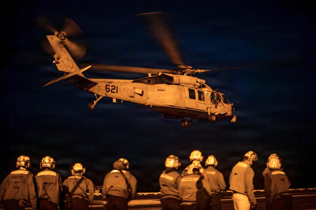 In this US Navy handout photo, an MH-60R Seahawk, attached to Helicopter Maritime Strike Squadron (HSM) 77, takes off from the flight deck of Nimitz-class aircraft carrier USS George Washington (CVN 73) on August 26, 2026. (Photo by NAVCENT Public Affairs / US NAVY / AFP) 