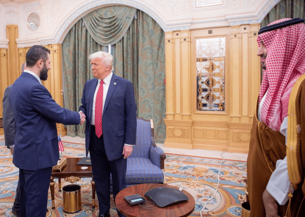 U.S. President Donald Trump meets with Syrian President Ahmed al-Sharaa in Riyadh, Saudi Arabia, in this handout released on May 14, 2025. Saudi Press Agency/Handout via REUTERS/File Photo