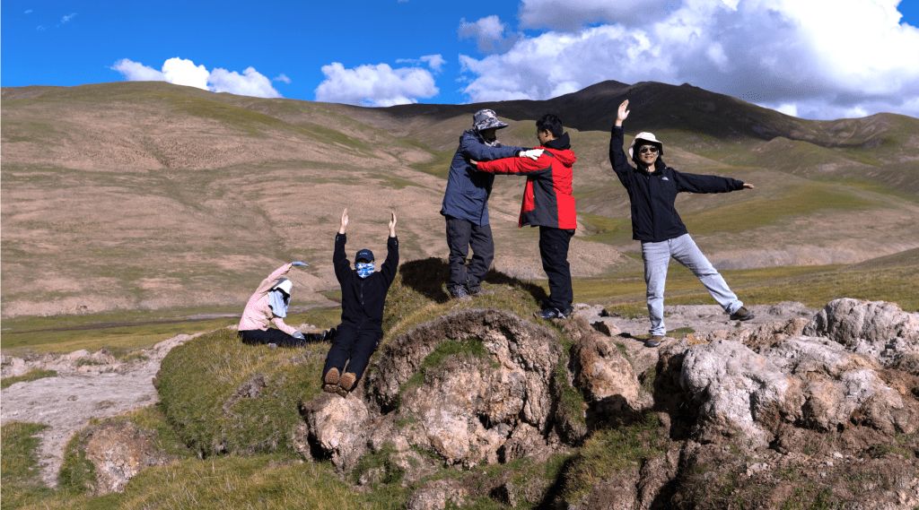 CUHK scientists next to a thaw slump in Qinghai-Tibet Plateau. (CUHK)