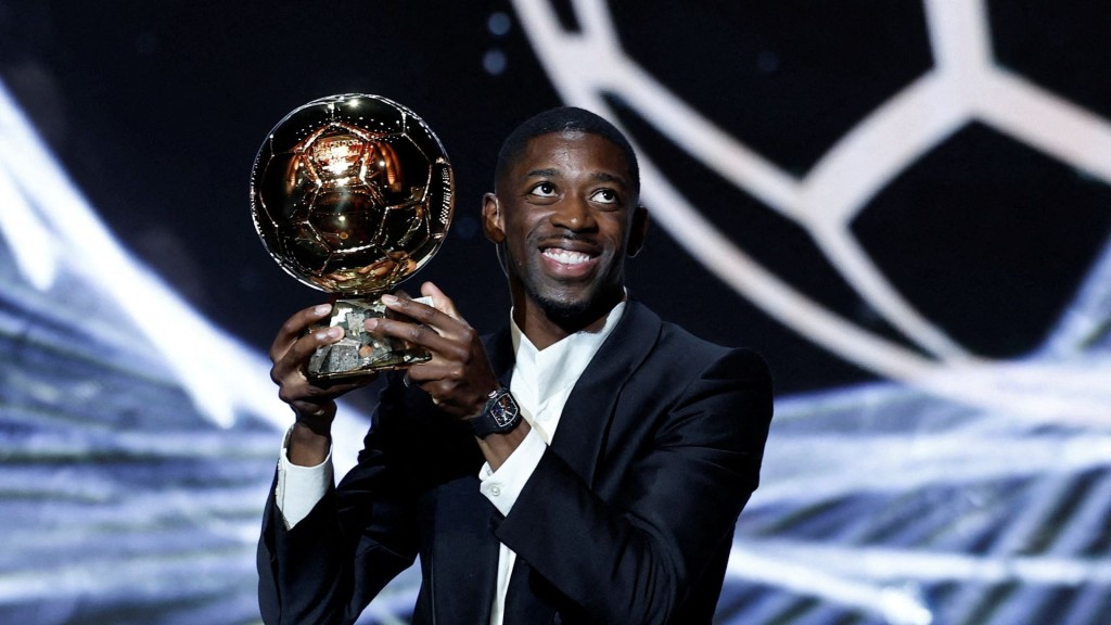 Paris St Germain's Ousmane Dembele celebrates after winning the men's Ballon d'Or award
