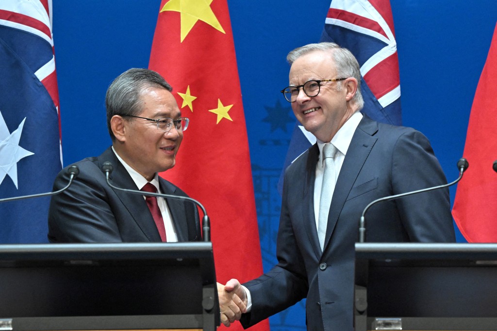 Chinese Premier Li Qiang and Australia's Prime Minister Anthony Albanese shake hands after making opening remarks at Parliament House in Canberra, Australia, Monday, June 17, 2024. (Reuters)