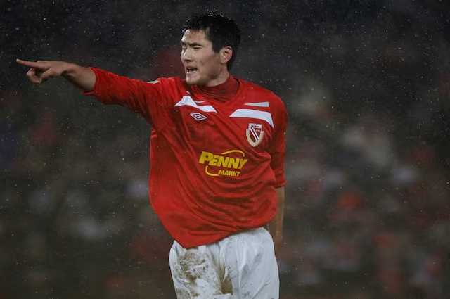 Energie Cottbus' Jiayi Shao reacts after scoring at the German soccer cup (DFB-Pokal) quarter-final match against TSG 1899 Hoffenheim in Cottbus, January 26, 2011. Energie Cottbus won the match 1-0. REUTERS/Tobias Schwarz/File Photo